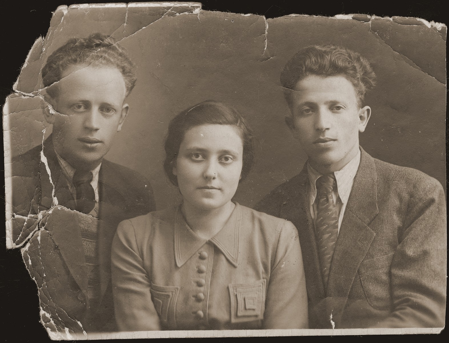 Portrait of Leon (right), Guta Akierman and their brother (name unknown).  Guta is the only survivor of her family.  The Akiermans were friends of the donor.
