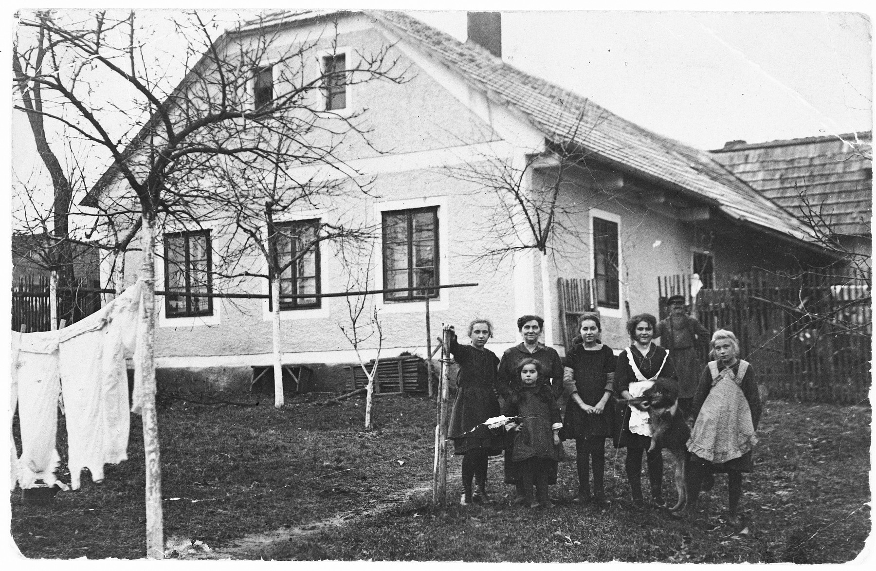 Members of a Jewish family pose outside their home in Pacov, Czechoslovakia.

Pictured are members of the Bruck family.