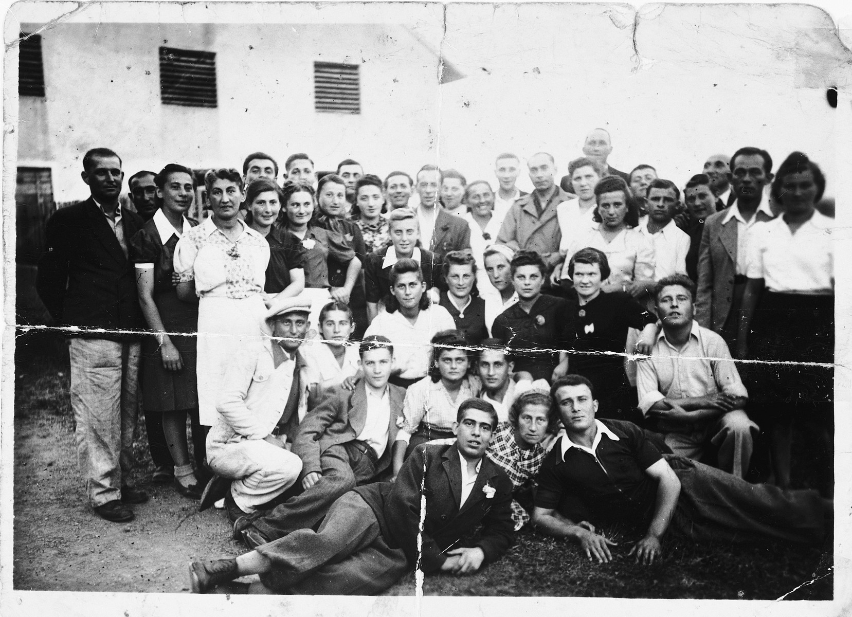 Group portrait of Jewish survivors who were liberated near Landsberg, Germany.