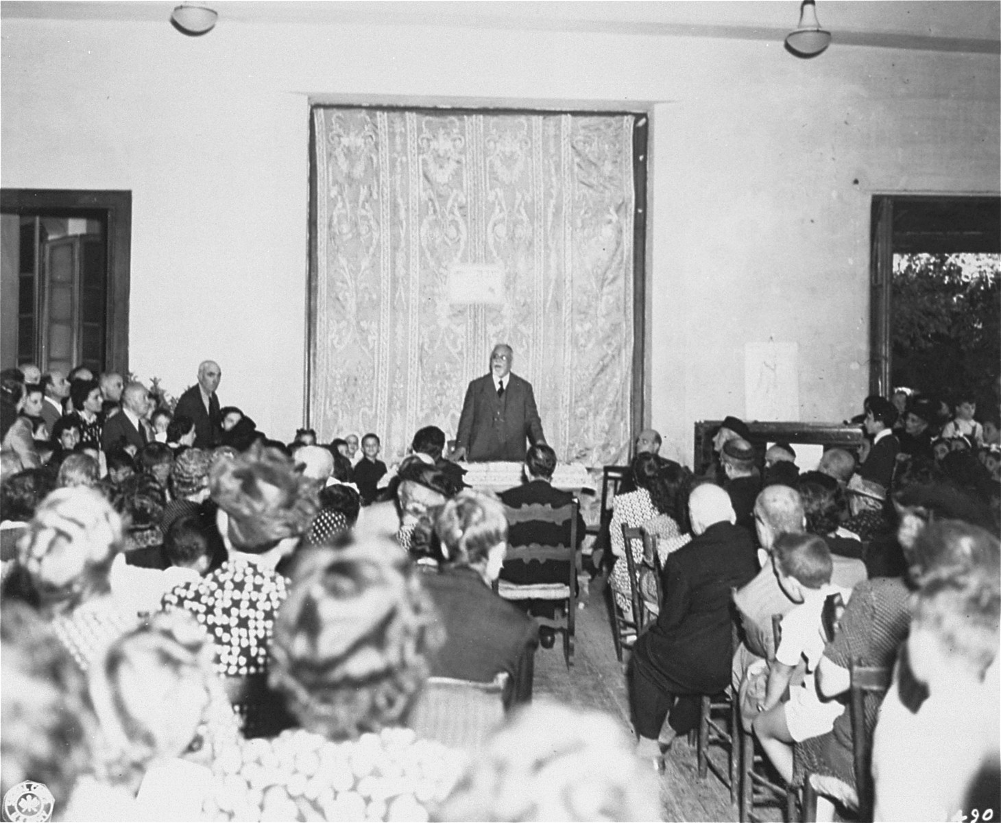 Rabbi David Prato, Chief Rabbi of Rome, speaks to a large congregation during ceremonies at the Jewish Orphanage in Rome.