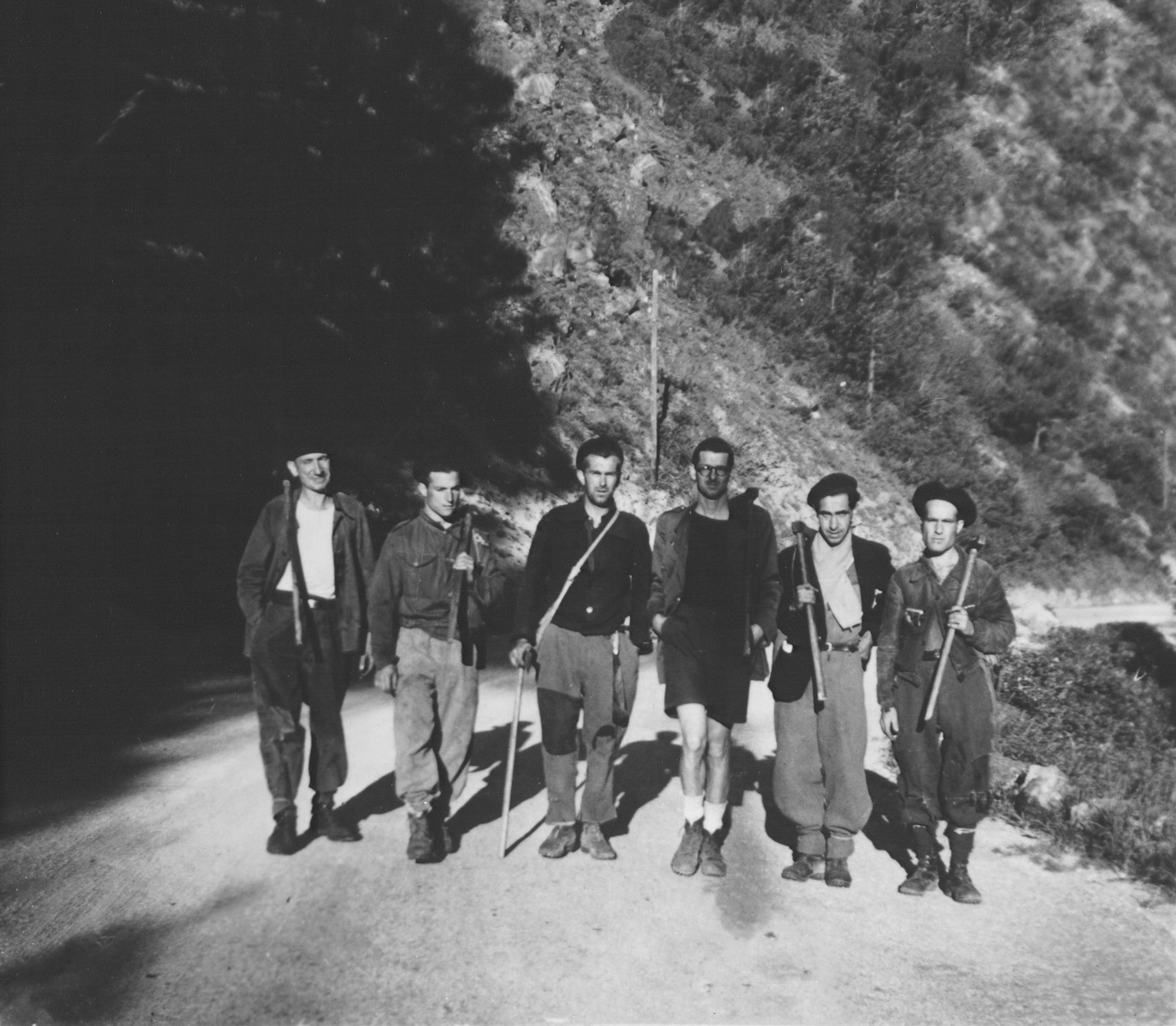 Rescuers and French vineyard workers at the foot of the Pyrenees, near the French-Spanish border.

Pictured is Daniel Benedite (third from right).