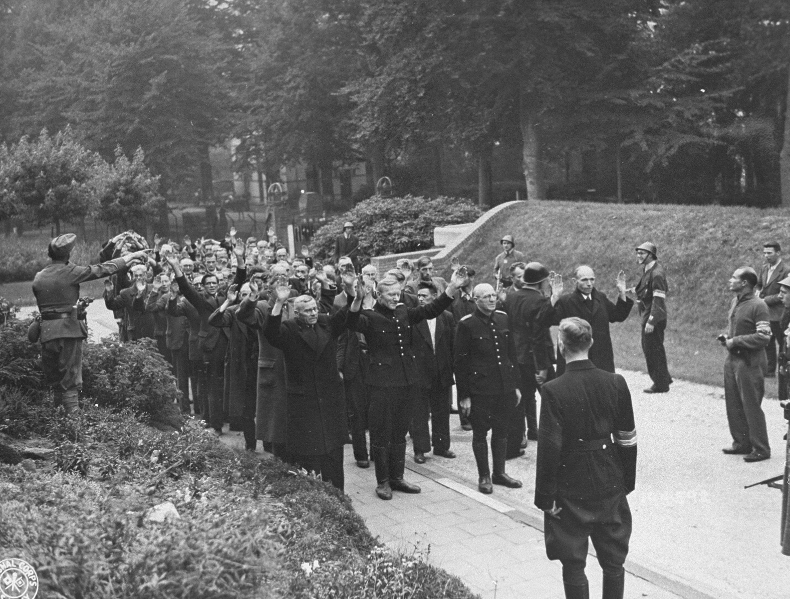 Dutch soldiers and members of the resistance arrest suspected civilian collaborators and former members of the Dutch Nazi Party.