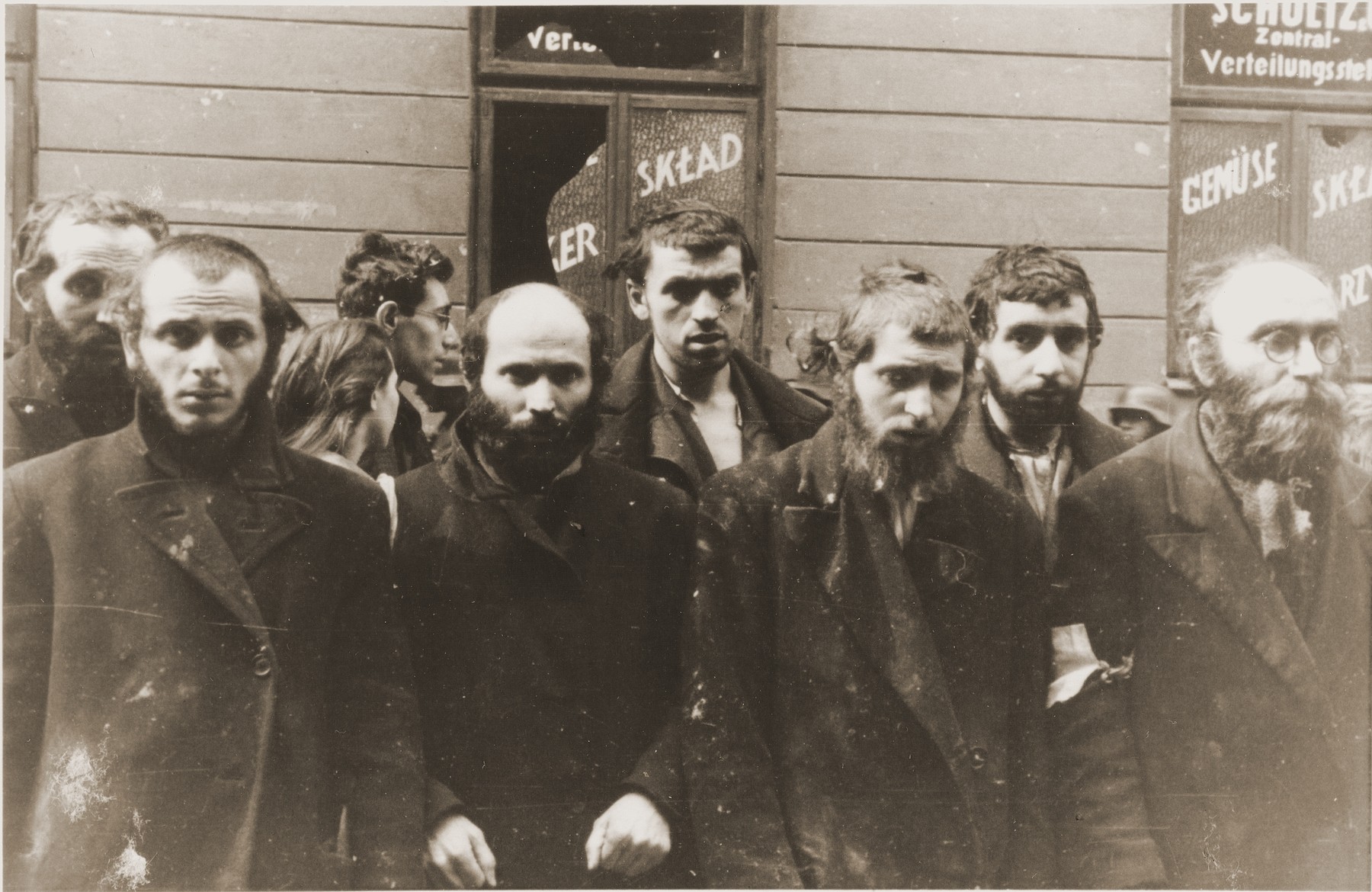 Religious Jews captured by the SS during the Warsaw ghetto uprising.  The original German caption reads: "Jewish rabbis."

From left to right are Rabbi Lipa Kaplan, Eliyahu Levin (son of Rabbi Hersh Henoch of Bedzin), Mendel Alter (son of Rabbi Nechemya Alter); Yankel Levin (son of Rabbi Mottel Levin of Lodz and grandson of the rabbi of Bedzin), unknown and Rabbi Heschel Rappaport, a Gerer Chassid and mentor to young Chassidim.