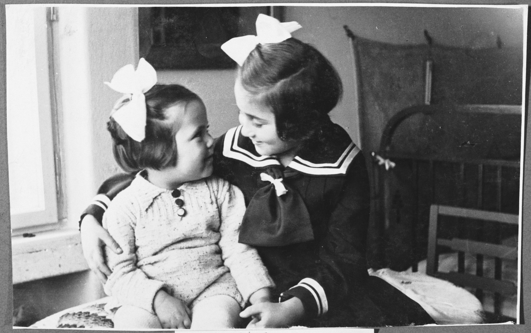 Two sisters pose for a photograph in the family's nursery. 

Pictured is the donor with her younger sister Karmella (Karmi).