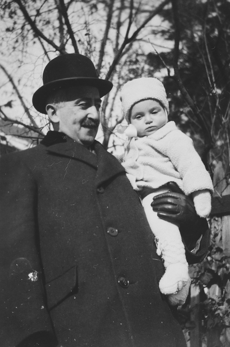 A Jewish doctor in Bratislava poses with his baby daughter.

Pictured is Dr. Geza Fisch and his daughter Hetty.