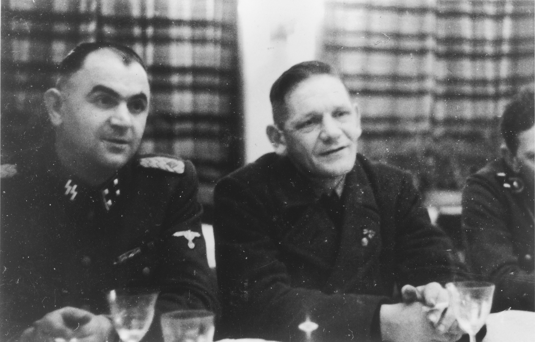 Two SS officers gather for drinks in a hunting lodge.

Pictured on the lett is Karl Moeckel.