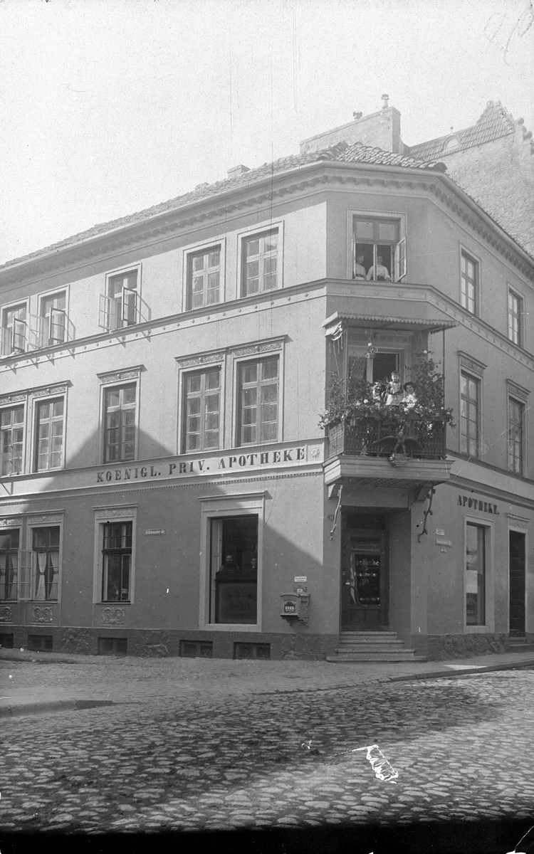 The Neustadt Pharmacy of Martin Wolff in Braunsberg, Germany (East Prussia). 

The family lived in the house upstairs, and the people shown on the balcony may be Martin, Paula and Hans Wolff.