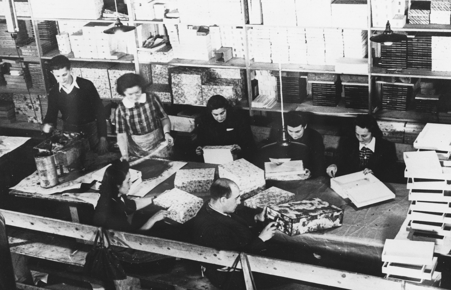 Prisoners make boxes at a Slovak labor camp.
