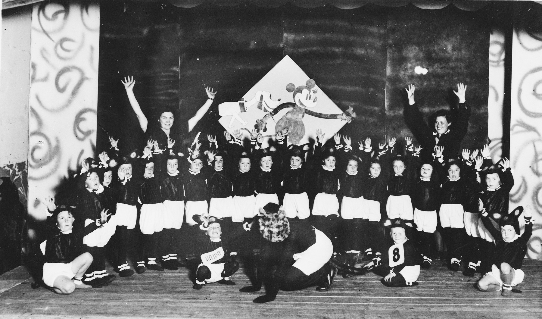 Children dressed as mice put on a school performance at the Novaky labor camp.

Among those pictured, in the second row, sixth from the right, is Mira Frenkel (now Frenkel).