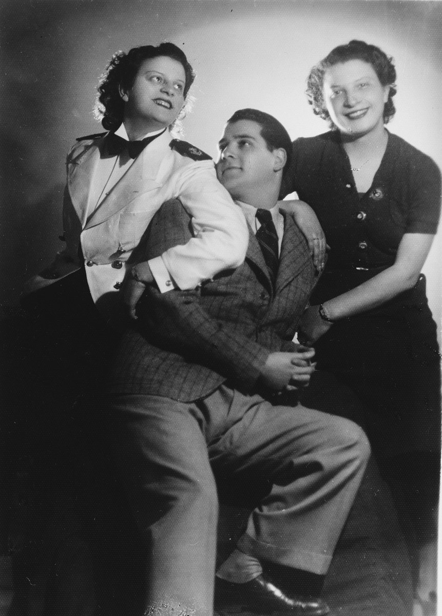 Studio portrait of a Greek-Jewish family of musicians.

Pictured are Michel Assael and his cousins Neta and Frieda Berubi.