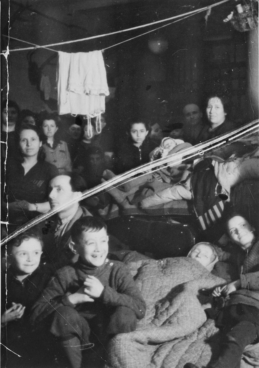Jewish displaced persons fleeing to the West rest in temporary quarters in Ostrava.

Among those pictured are Lova Warszawczyk.