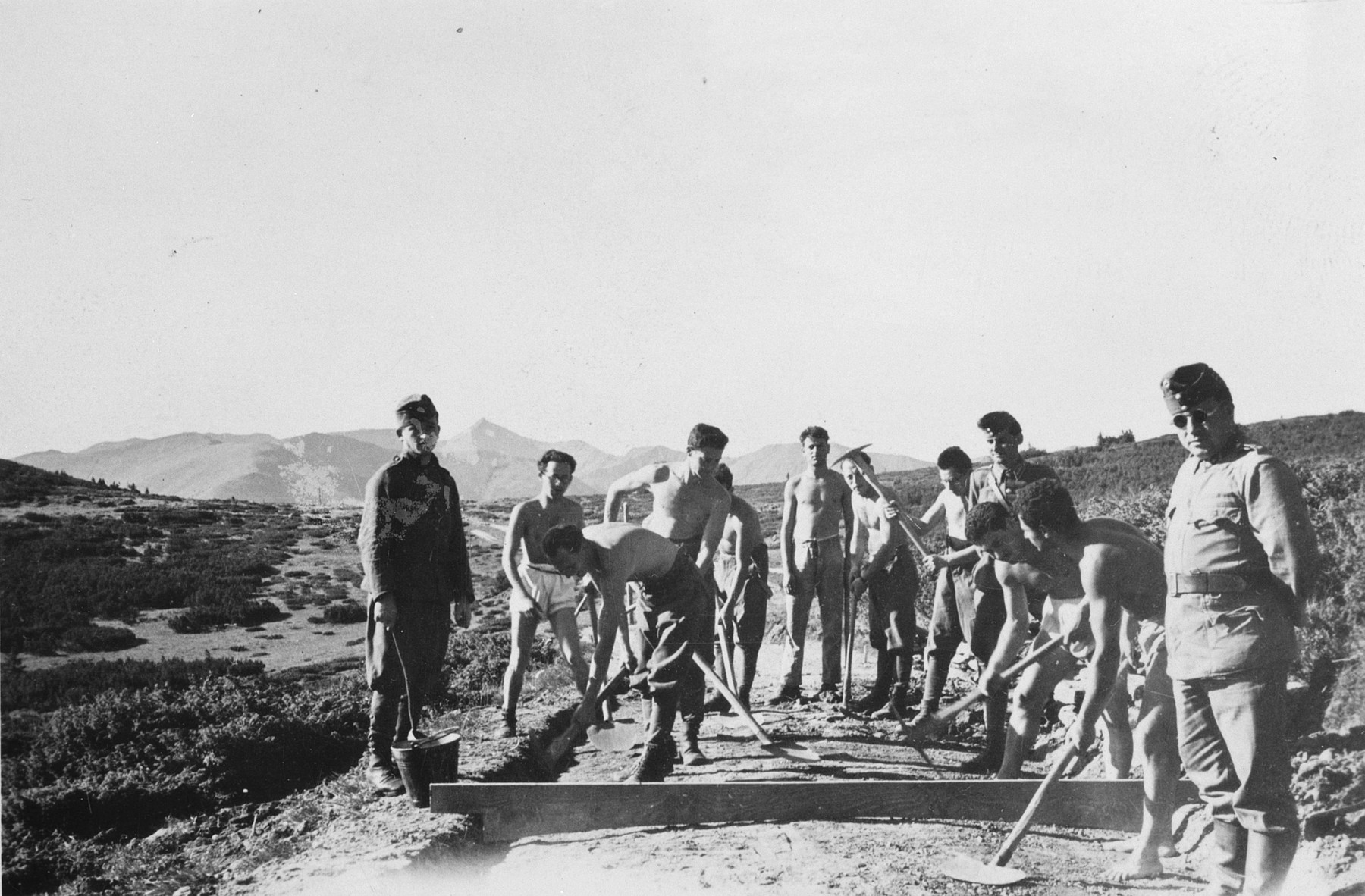 Members of a Hungarian forced labor battalion construct a road in Koszeg.