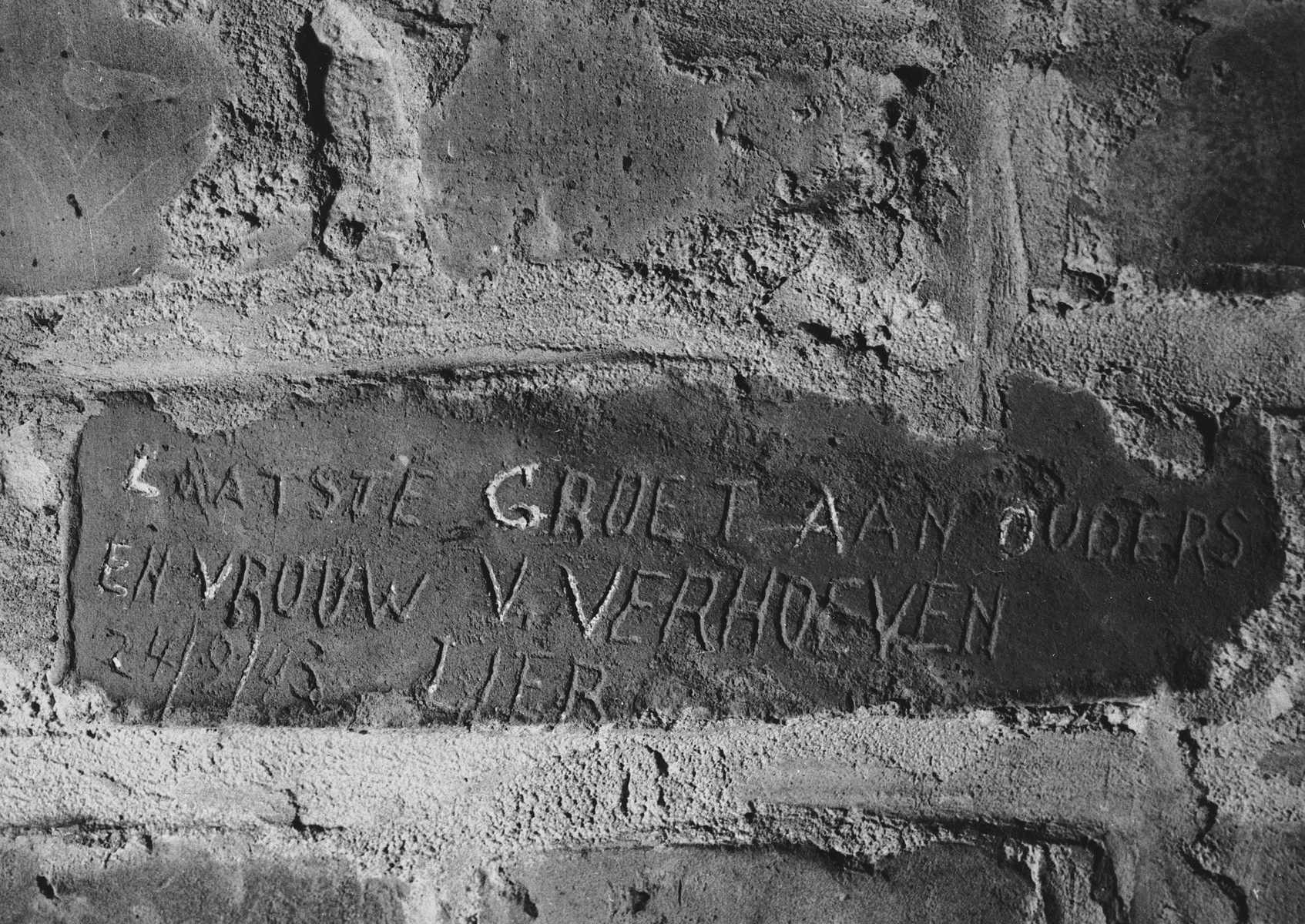 Prisoner name scratched on the wall of the Breendonck internment camp.