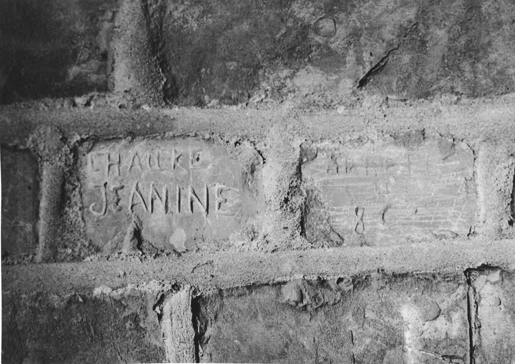 Prisoner name scratched on the wall of the Breendonck internment camp.