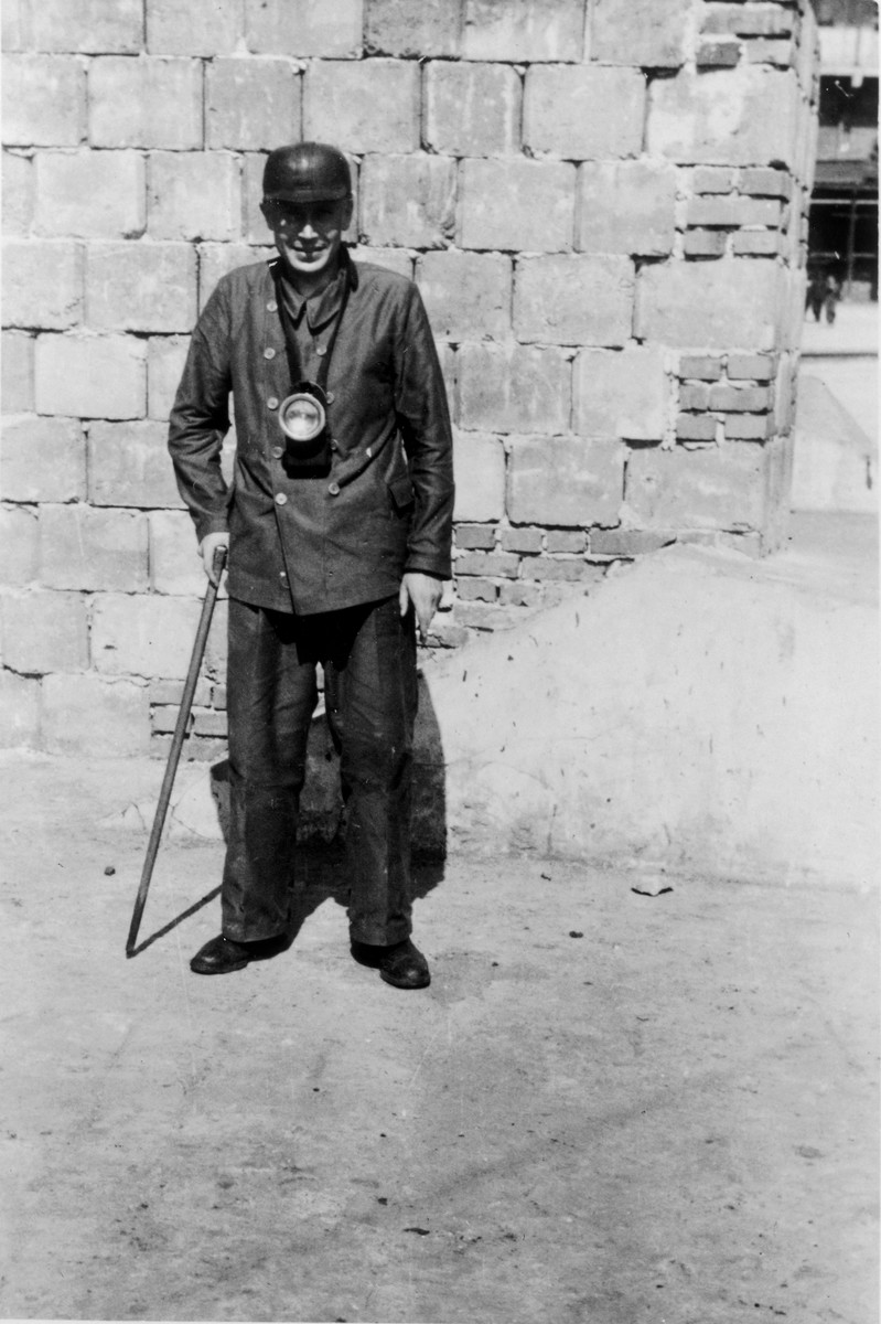 SS officer Karl Hoecker visits a coal mine near Auschwitz.

The original caption reads "Als Bergmann" (as a miner).