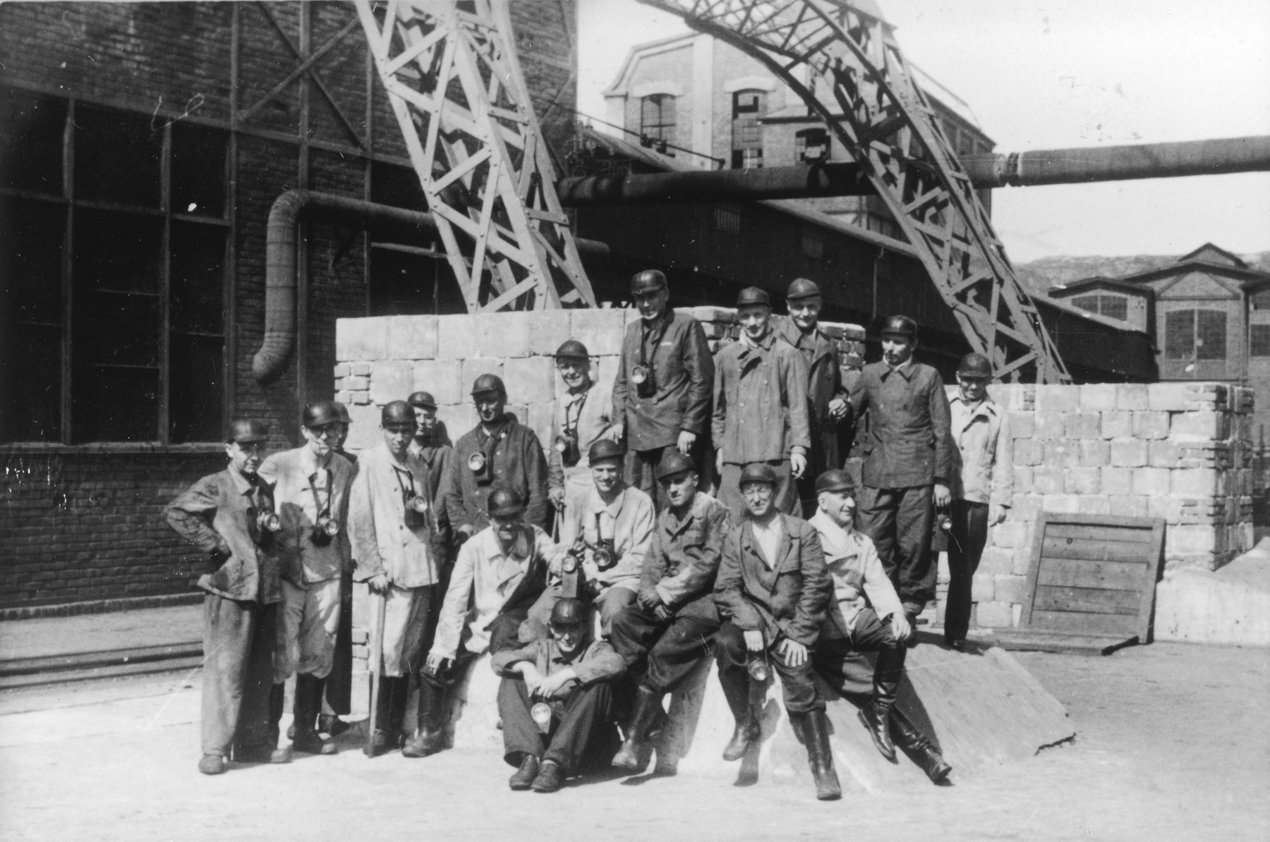 A large group of SS medical personnel visit a coal mine near Auschwitz following the dedication of the SS Lazerette.

The original caption reads "Besichtigung eines Kohlenbergwerks." (visiting a coal mine).

Seated in the front center is Gerhard Gerber.  Seated behind him (left to right) are Waldemar Wolter, possibly Weber, Alfred Trzebinski, Richard Trommer, and Fritz Klein.  Standing left to right are Willy Frank, unidentified, Wilhelm Witteler, unidentified, Max Blancke, Karl Hoecker, Enno Lolling, Eduard Wirths, Heinz Baumkoetter and Sohatz.