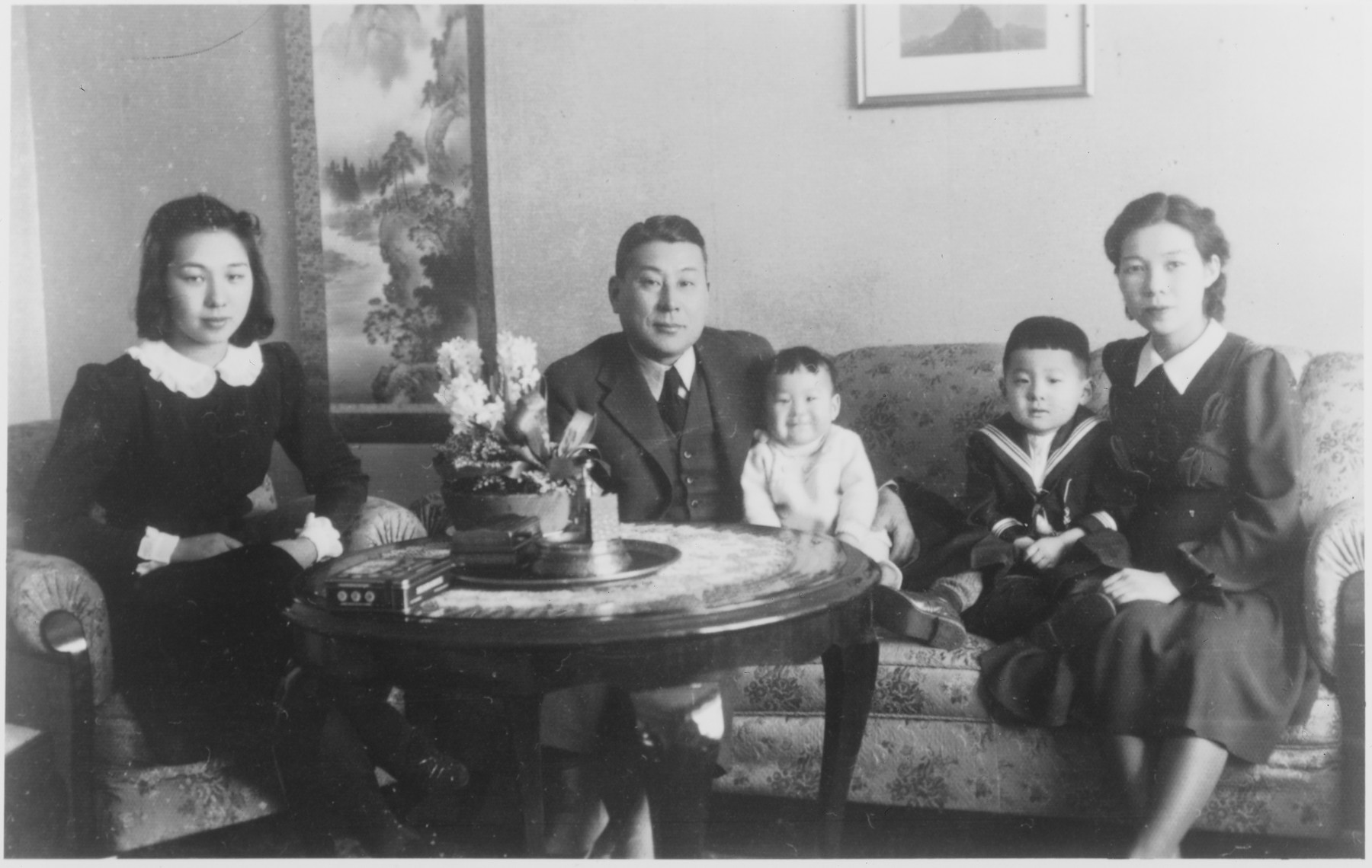 The Sugihara family sits in the living room of their residence in Kaunas shortly after their arrival.  

Seated from left to right are: Setsuko Kikuchi (Yukiko's sister), Chiune Sugihara, Chiaki, Hiroki, and Yukiko Sugihara.