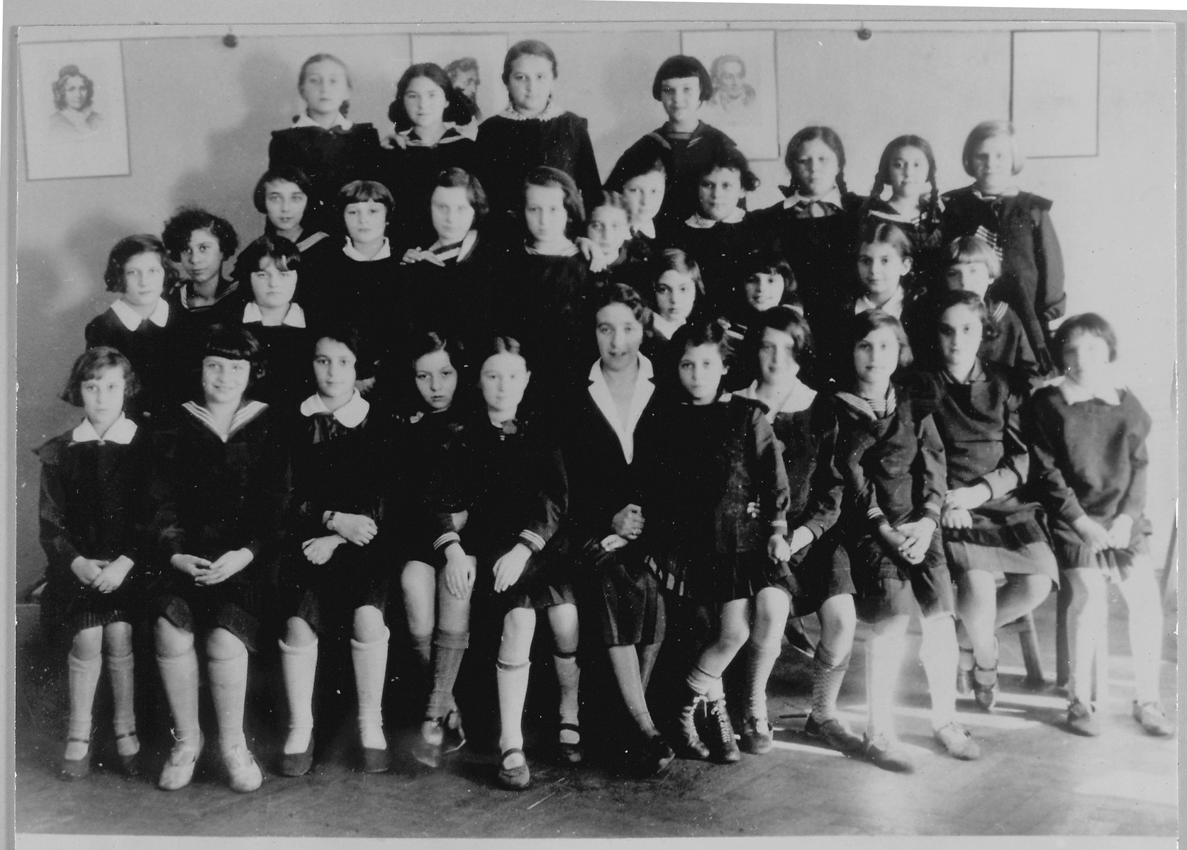 Rys Berkowicz's gymnasium class in 1932.   

Rys Berkowicz is seated to the right of the teacher.