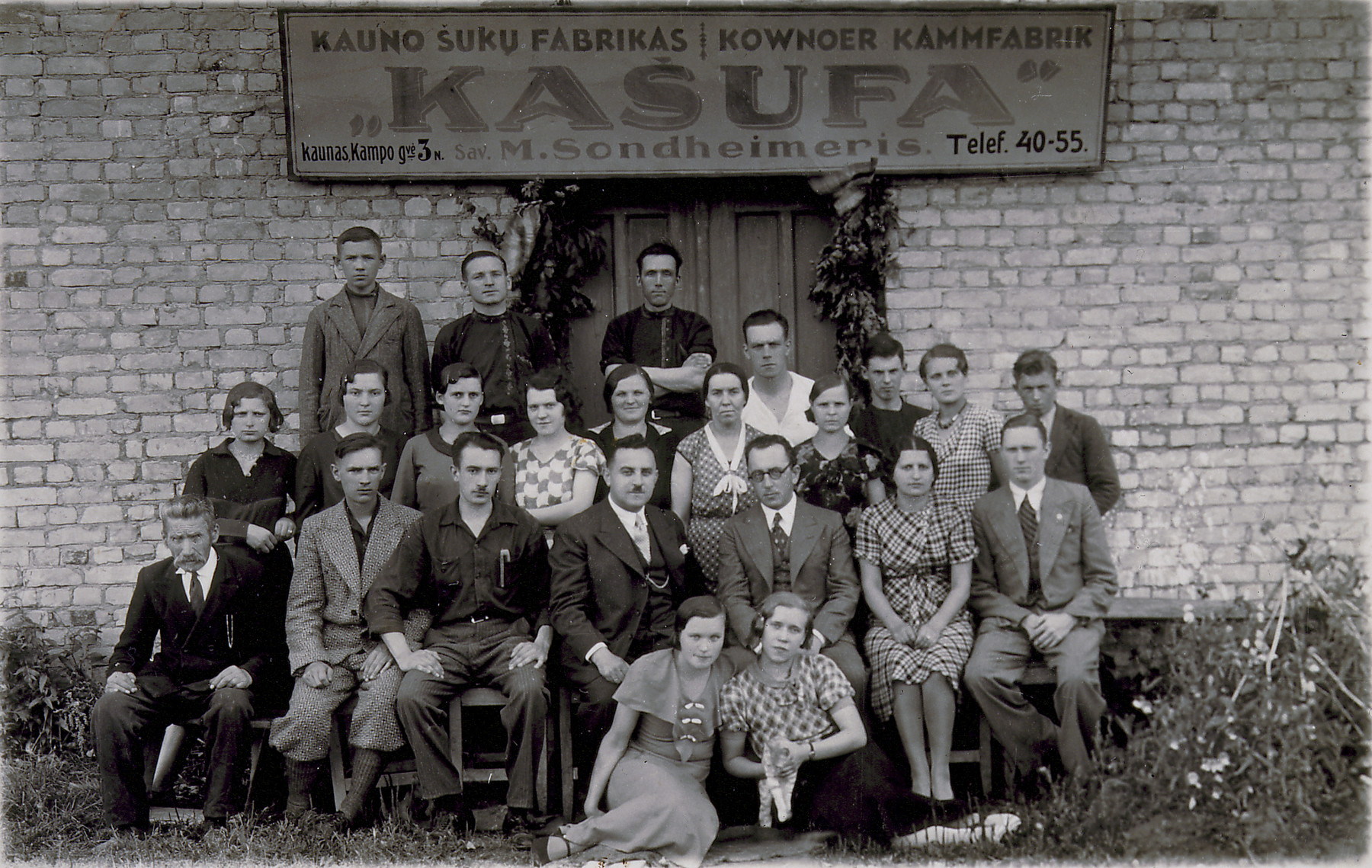 Group portrait of the employees at Moritz Sondheimer's  Kasufa plastics factory.  

Moritz sits in the front row, fourth from the left.