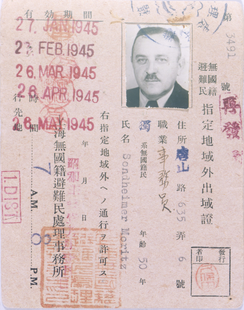 Shanghai ghetto pass issued to Moritz Sondheimer.

After the creation of the restricted district in Shanghai, residents were required to wear pins and to carry these passes in order to leave the district. The pins were color-coded to show how long the pass was valid for.