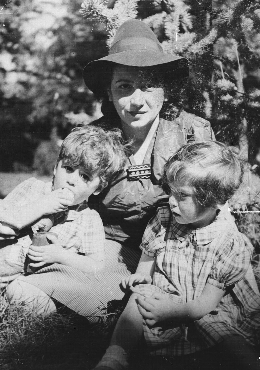 A Jewish woman visits her two children in the Limoges children's home, la Pouponniere, shortly before she removed them from the home to go into hiding.

Pictured are Sabina Findling and her two children.