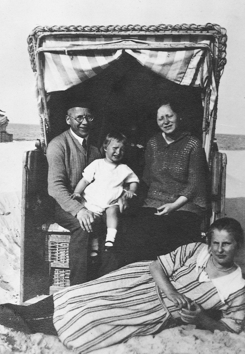 An intermarried German-Jewish family rests in their cabana on a beach on the Baltic Sea.

Pictured are Franz John, his daughter Eva and sister-in-law Regina (Rina) Bluth.