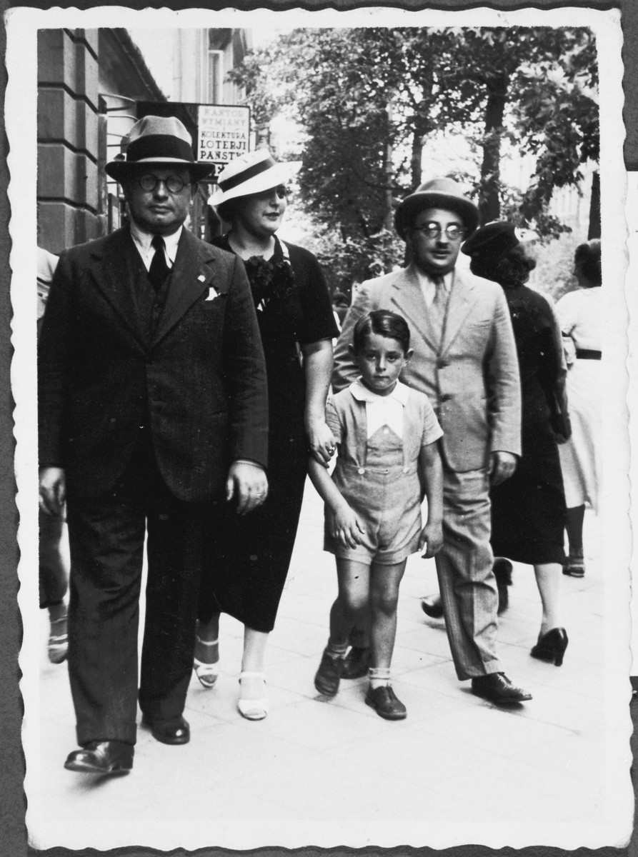 The Minerbi family walks down the streets of Warsaw.

Pictured from left to right: Arturo Minerbi, Fanny Ginzburg Minerbi, Sergio Minerbi and Leo Ginzburg (the brother of Fanny).