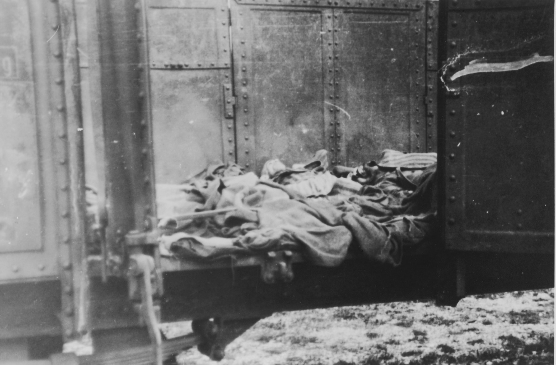 Corpses lie in one of the open railcars of the Dachau death train.