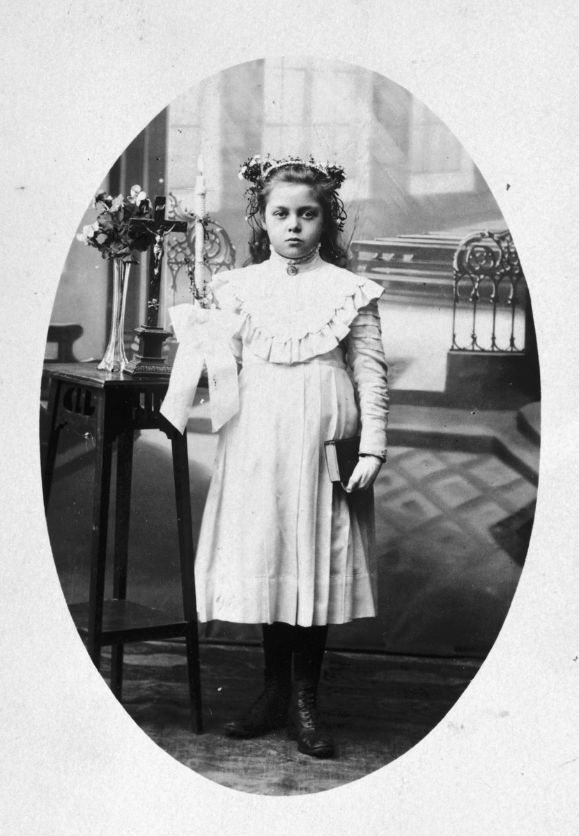 Prewar communion picture which was brought with the donor's family  to Rivesaltes and which ended up saving them from deportation.

Originally the entire family was slated for deportation, but just as they were about to board the train, the donor's mother showed the officials her childhood communion photo proving that she was not Jewish.  Her two daughters were also pulled from the transport.  Unfortunately, her Jewish husband was not spared.  He was transported to Drancy and from there to Auschwitz where he perished.