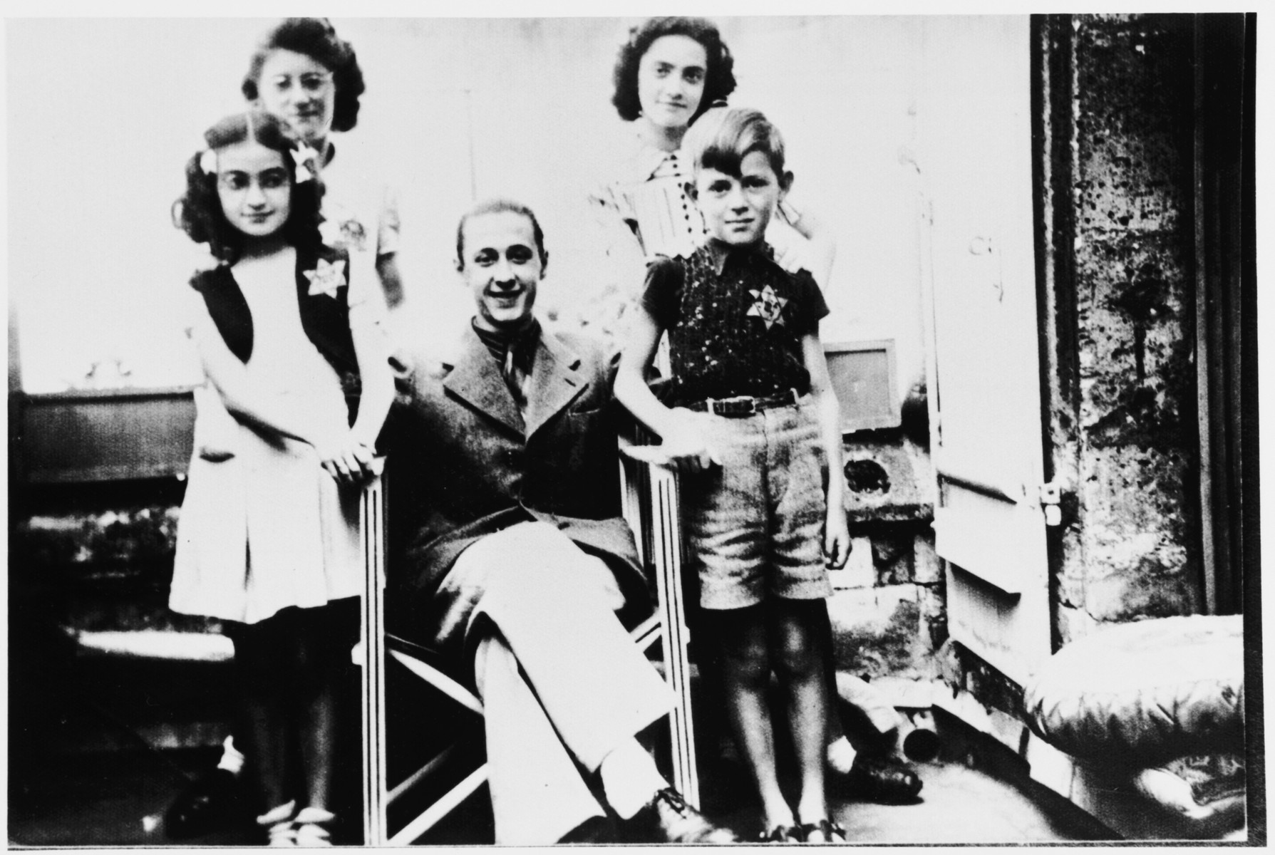 Group portrait of French Jewish children wearing a Jewish star.

Among those pictured are Paulette and Ruth Apfel and Roger Vinnitsky.