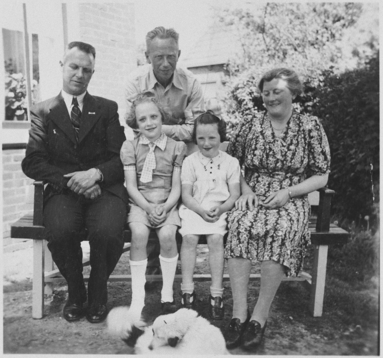 A Jewish father reunites with his daughter at the home of her rescuers shortly after the end of the war.  

Seated from left to right are Dirk Hellinga, Janny Sluimer, Meip van Engel and Sjoukje Hellinga. Bernard van Engel is standing behind them.