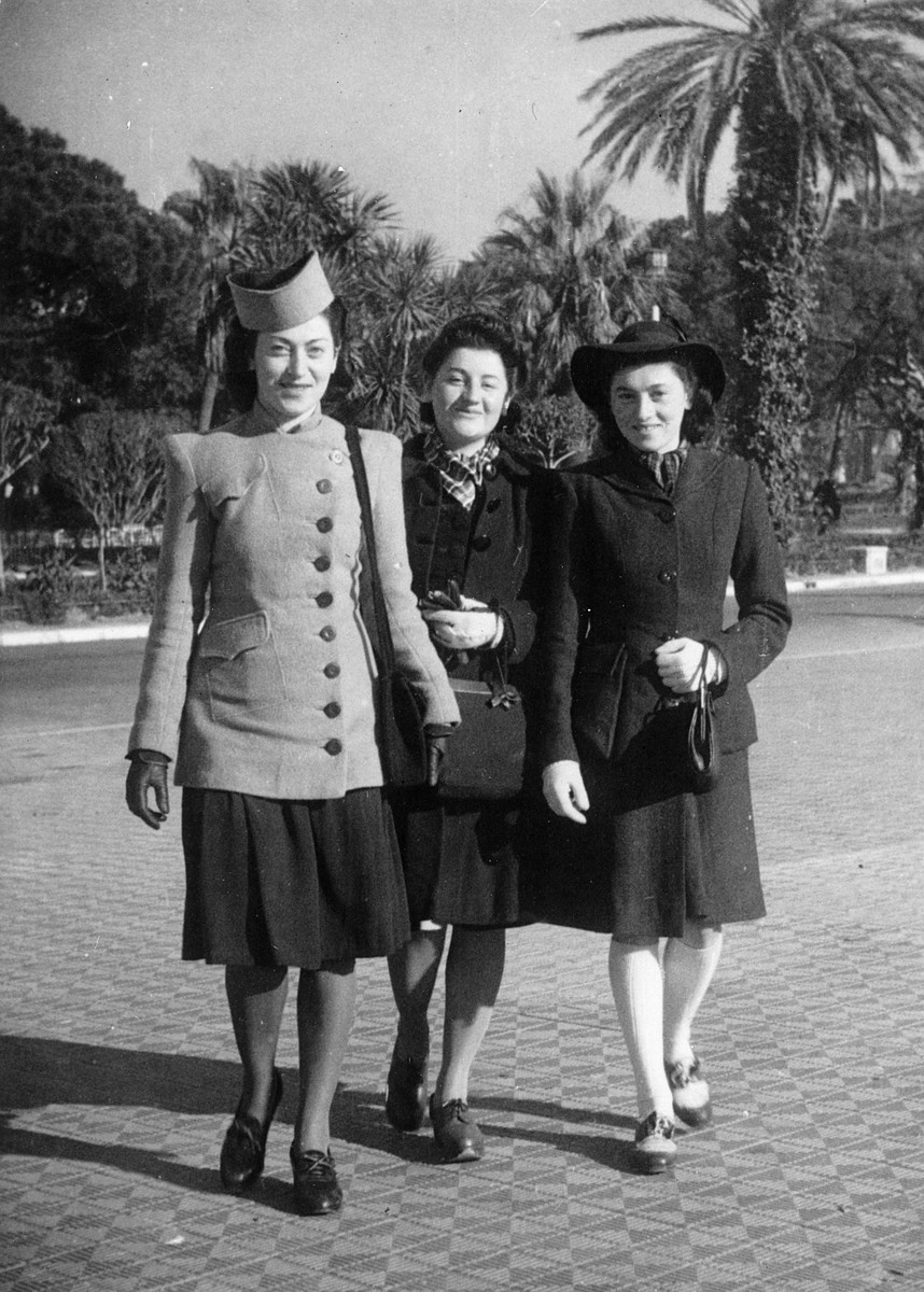 Three Jewish women in hiding prepare to go to the wedding of their older brother in Nice.

From left to right are Annie, Adele and Helene Steinberg.