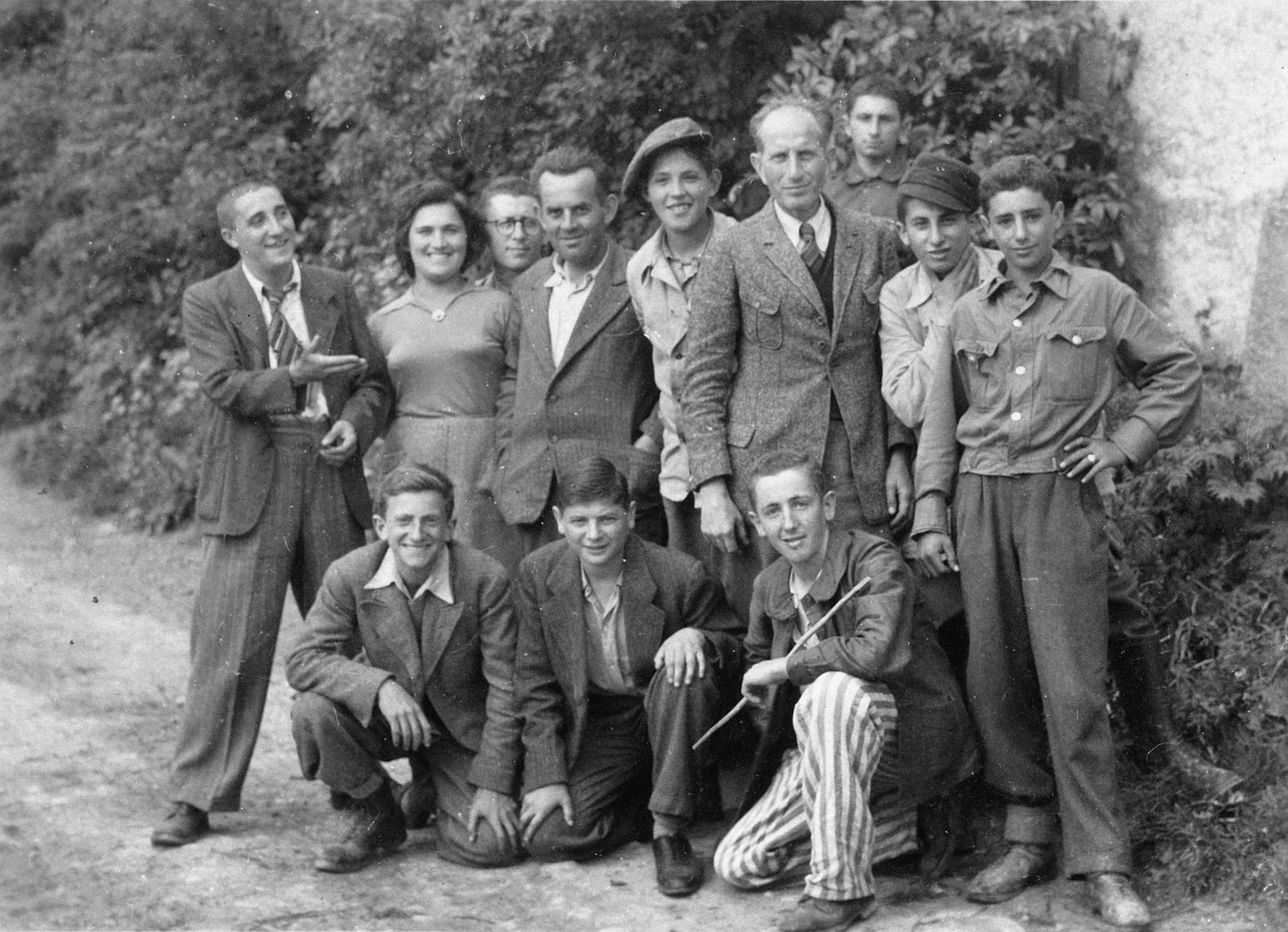 Group portrait of survivors of a Kaufering sub-camp one month after liberation.

Among those pictured are Uriel Hanoch (standing fifth from the left).