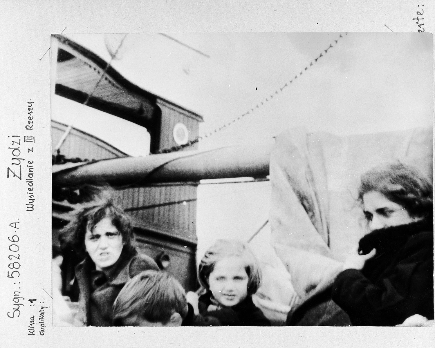 A group of German-Jewish refugee women and children aboard a Greek vessel [the Aghia Dezioni] on their way to Palestine.  

One hundred seventy  Jewish refugees came to Fiume, Italy and were placed aboard a small Greek coastal steamer. Their passports contained visas for China. However, when the ship reached the open sea, their passports were forcibly taken and thrown into the sea. The refugees were told they would disembark in Palestine. After 36 days of floundering in the eastern Mediterranean and severe mistreatment aboard ship, 120 refugees managed to enter Palestine. There they were discovered by the British army and placed in the Sarafend camp for new immigrants.