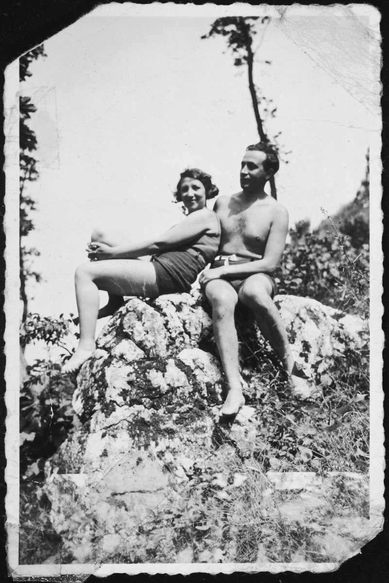 A Jewish couple sitting on a rock.

Pictured are Rita Blumstein's parents in late summer.