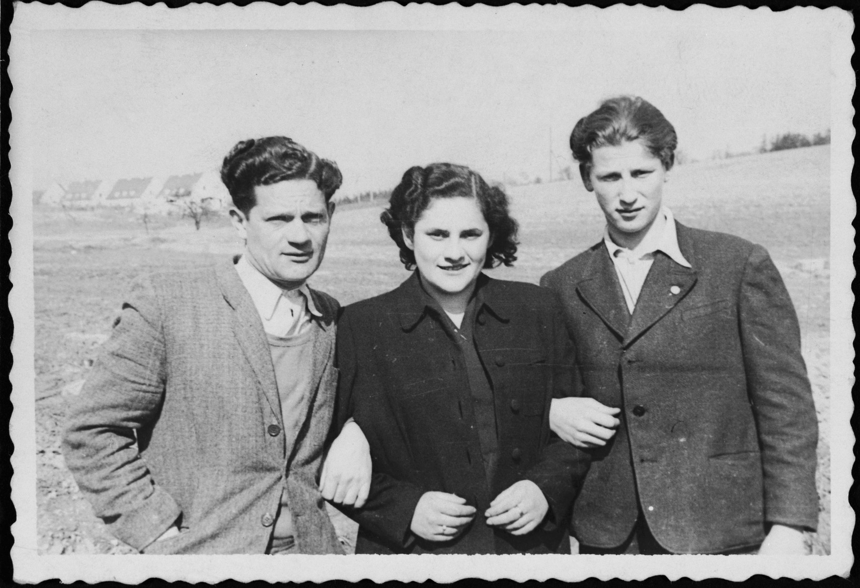 Portrait of three young people in the Bindermichl displaced persons' camp in Linz, Austria.

Among those pictured is David Suchman (far left).