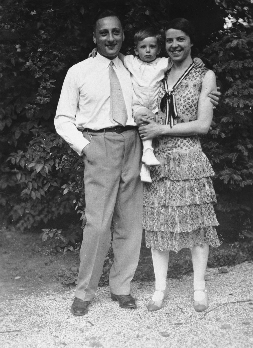 A German-Jewish couple poses in a garden with their two-year-old son.

Pictured are Karl, Rolf, and Joahanna Blumenthal.