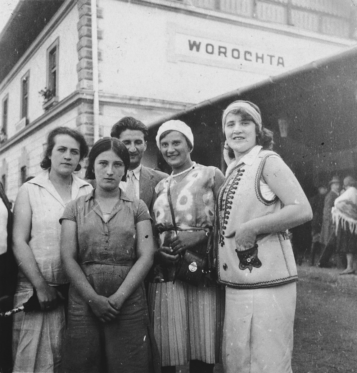 A group or friends and relatives gather outside a hotel in a mineral spa resort.

Among those pictured are Samuel and Sidonia Grunfeld, and Samuel's sister, Bertha.