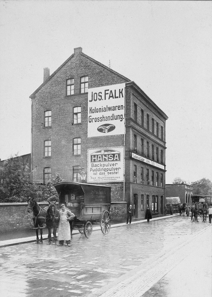 A man stands with his cart and horses outside a business.

Pictured is the company building of Rolf Blumenthal's paternal grandfather, Julius Blumenthal (who partnered with Josef Falk.)