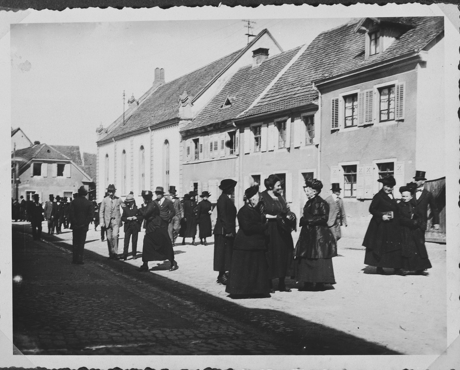 German Jews congregate on the street outside the synagogue in Breisach after Saturday morning services.

Rosa Geismar (nee Uffenheimer) is third from the right.