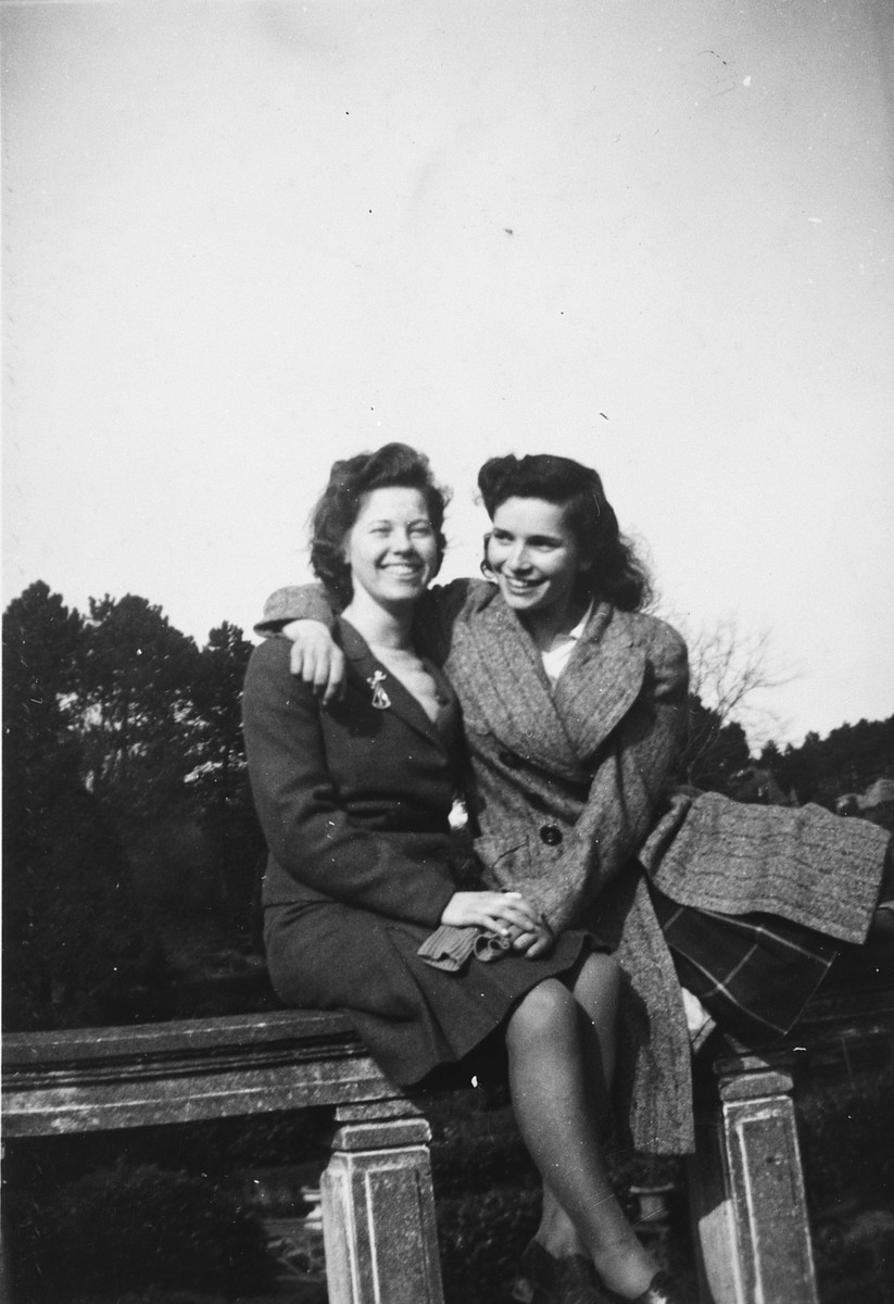 A German-Jewish teenage girl poses next to her friend while in England on a Kindertransport.

Pictured are Ursula Totschek (right) and her friend Jean Prodham.