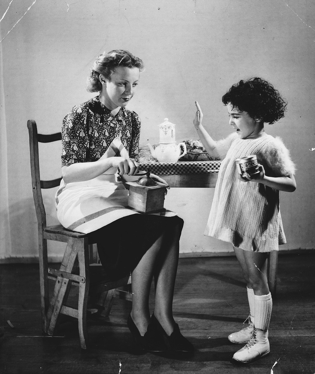 Advertising photograph of a woman holding a coffee grinder and a child holding a can of Nescafe.

The child is Regine Gartenlaub.