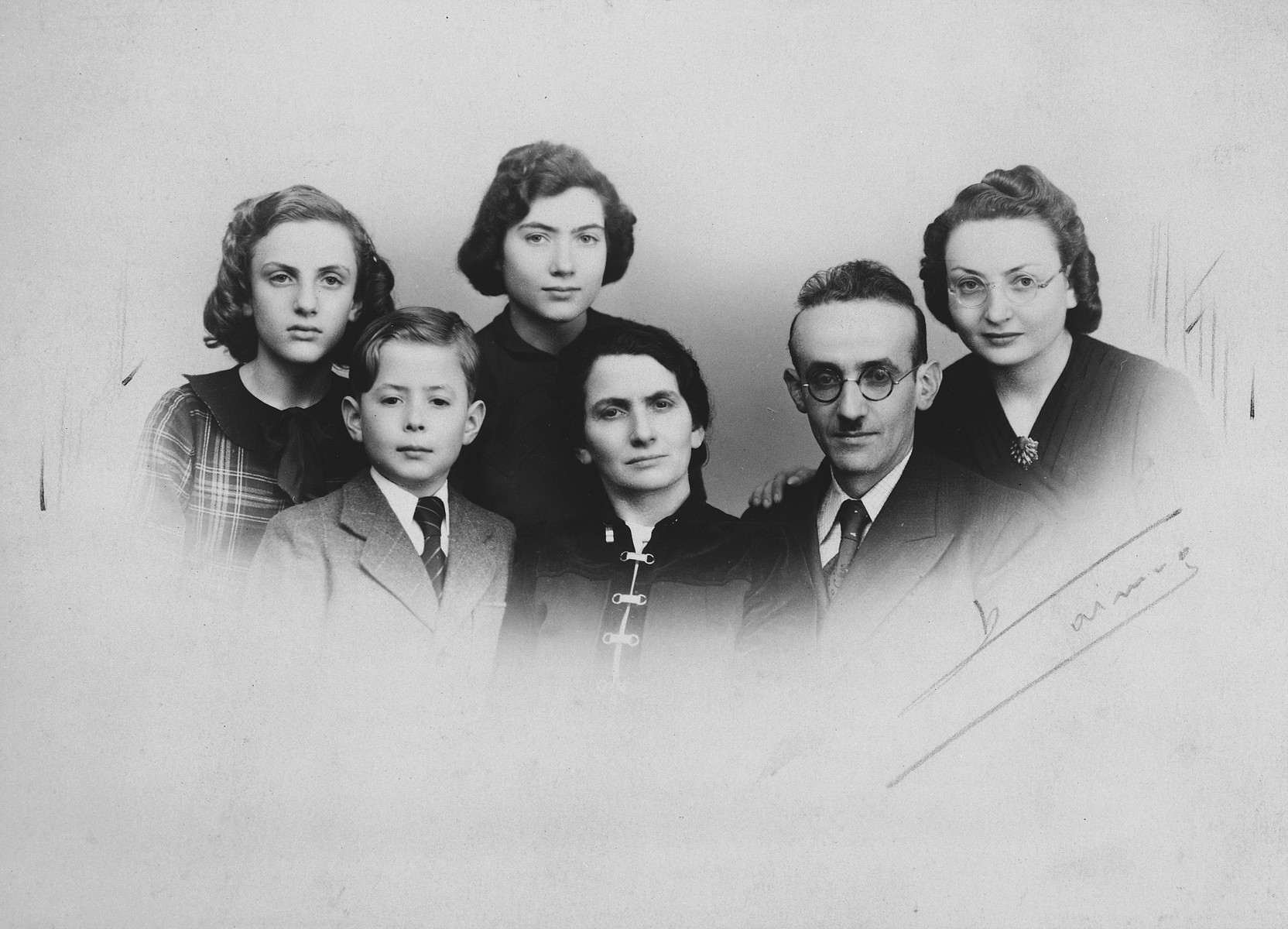Wartime portrait of a French-Jewish family.

From left to right are Suzanne, Henri, Rosette, Gittle, Shimon and Sarah Rivka Bomblat.