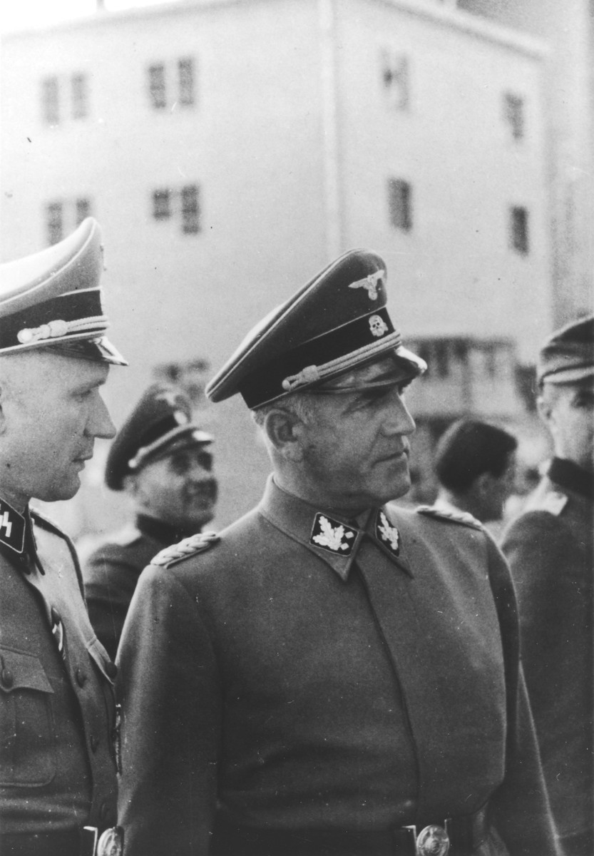 SS General Oswald Pohl pays an official visit to Auschwitz accompanied by Auschwitz Commandant Richard Baer who had previously served as his adjutant.

In the background between Baer and Pohl is Karl Bischoff.