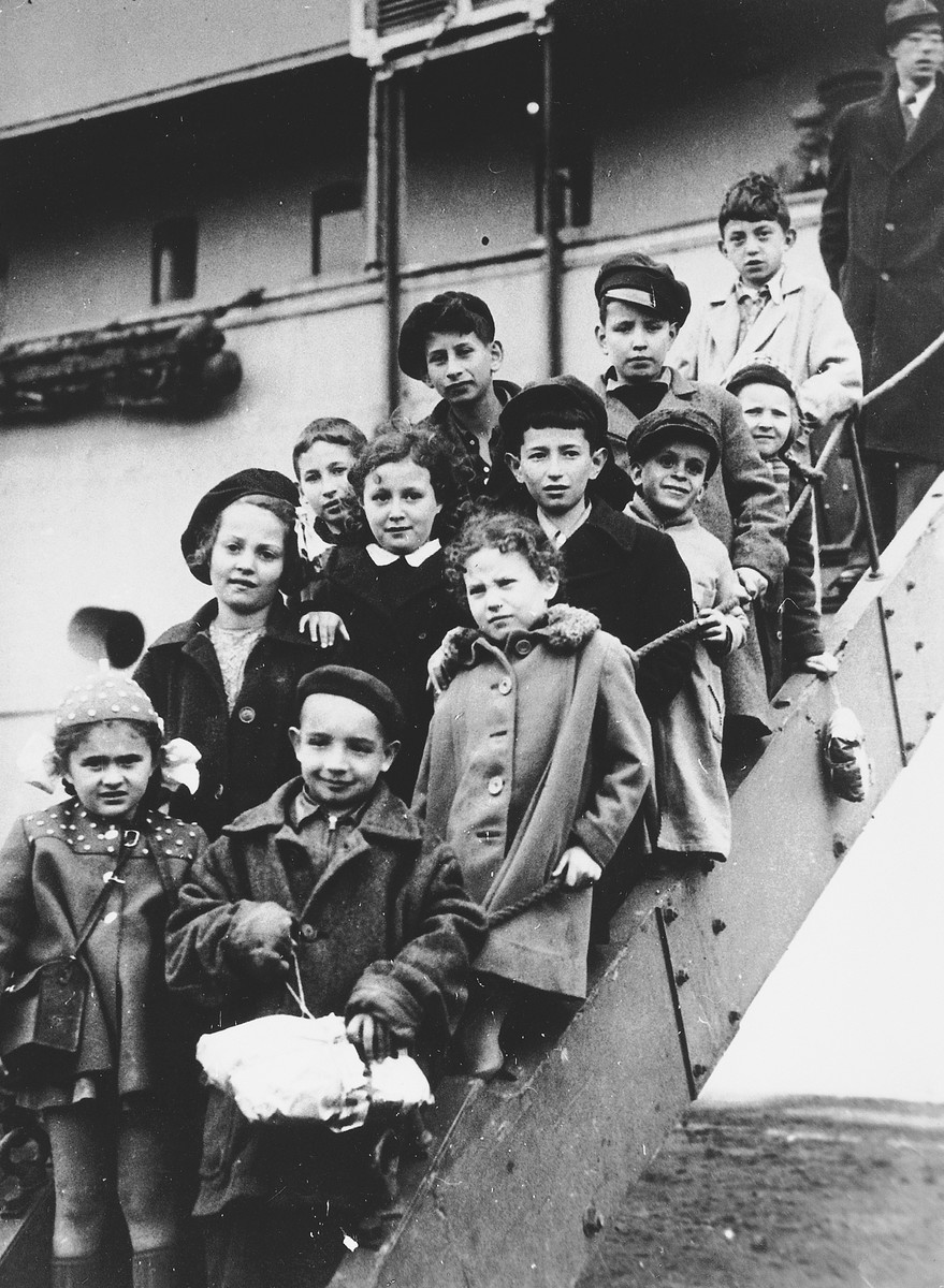 A group of child survivors arrives by ship in Scotland in a transport organized by Rabbi Solomon Schonfeld.

Approximately 200 children left on this transport organized with the support of the British Foreign Office.

Among those pictured are Hannah Greenberg (center, second from left) and Jerzy Hoffman (behind her), his cousin Stephanie Hoffman (later Portnoy, second row, right) and Elek Rebensztok (fourth row, right).