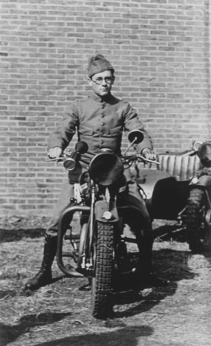 A Jewish soldier in the Dutch army poses astride his motorcycle.

Pictured is Leo Krell.