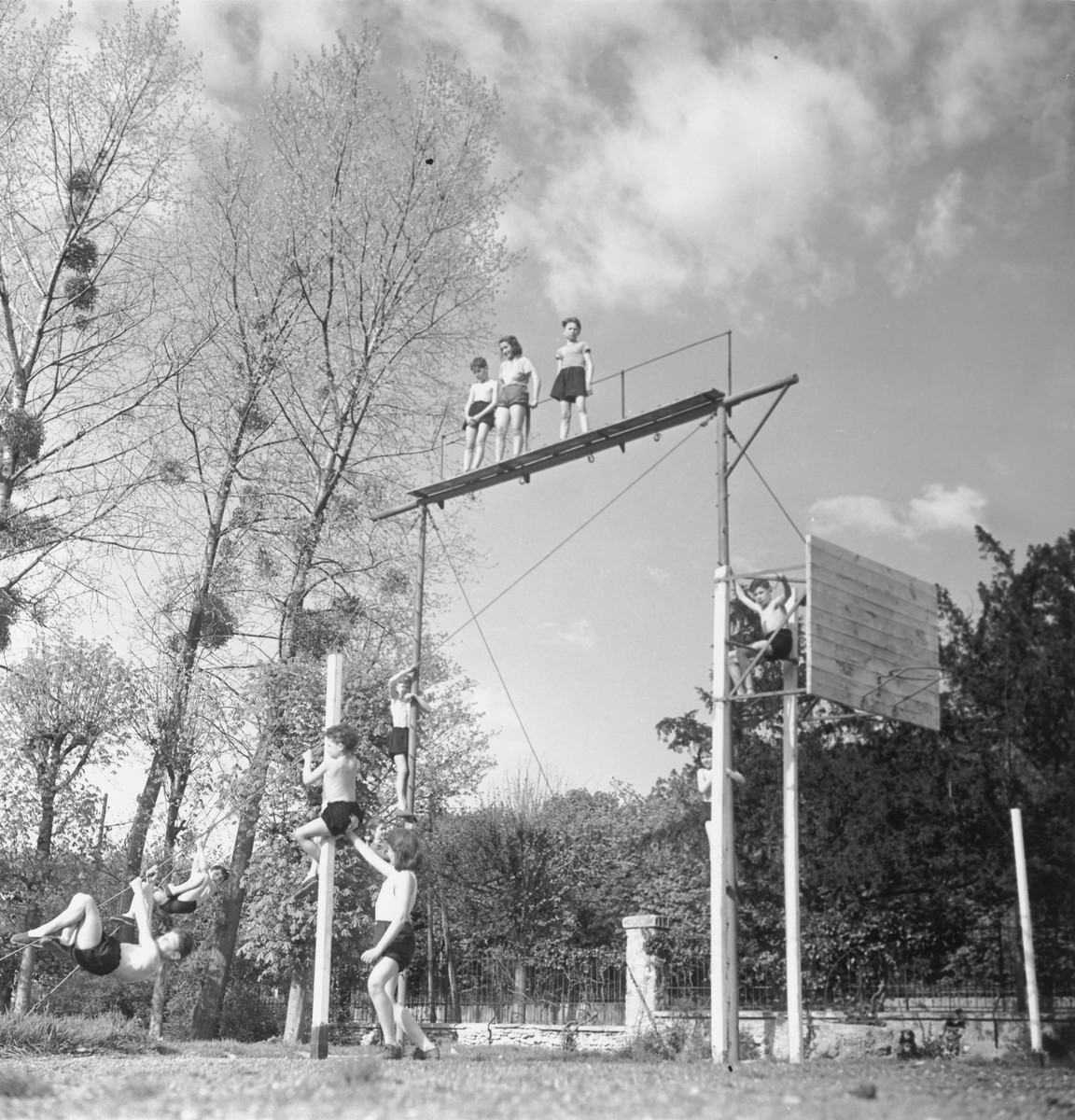 Children scale poles and platforms in Gournay-sur-Marne, an OSE kinesthetic institute for children with bone deformations.