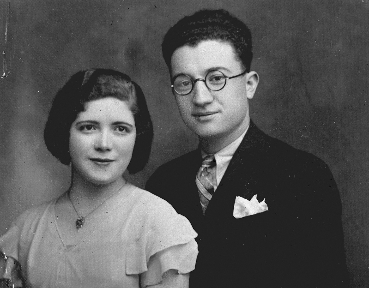 Studio-portrait of a young Greek-Jewish couple in Ioannina.

Pictured are Nissim and Eftyhia Samuel.