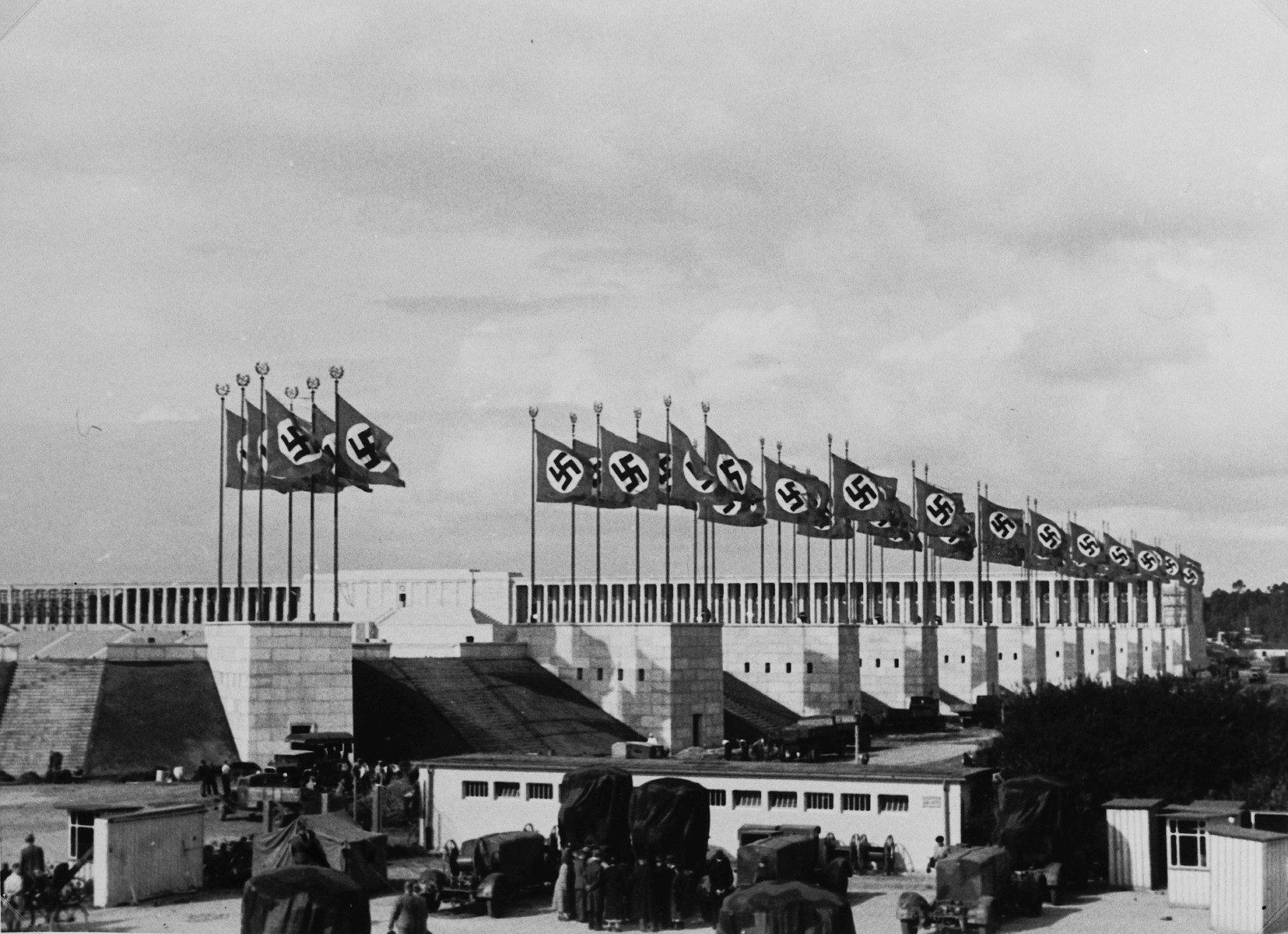 Nazi flags wave above the stadium for the Nuremberg rally.

This photograph was taken by a German Jewish woman, Lilli Rahn, who later emigrated.