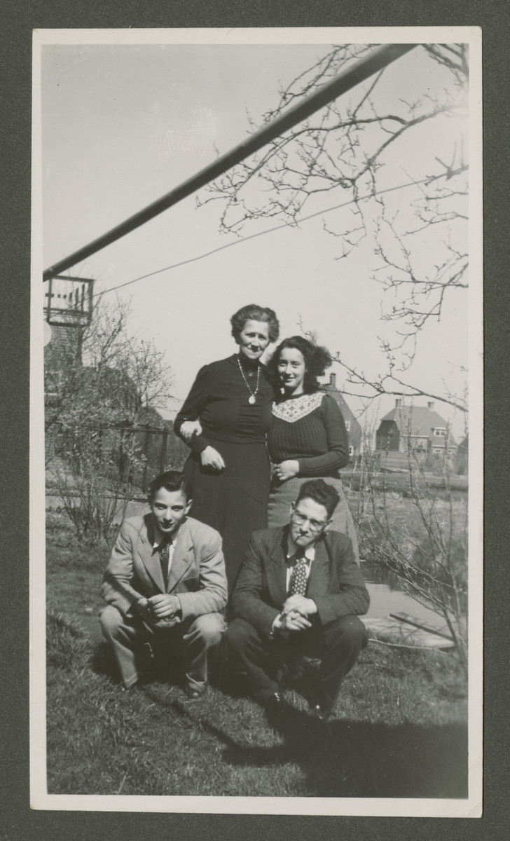 Elly Rodrigues poses with her rescuer/foster mother Grietje Bogaards after the war.

Also pictured are her brother Henri (bottom left) and another young man.